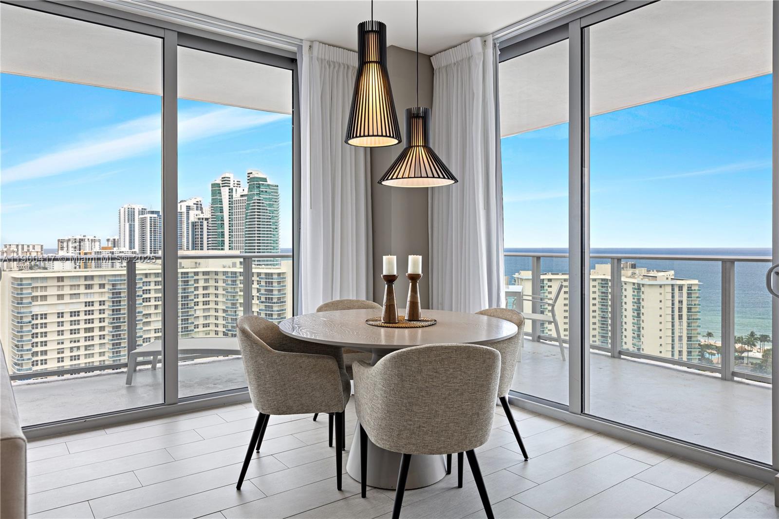 4010 South Ocean Drive, Unit R1701 Hollywood, FL 33019 - Photo 11 of 48 a dining room with furniture and window