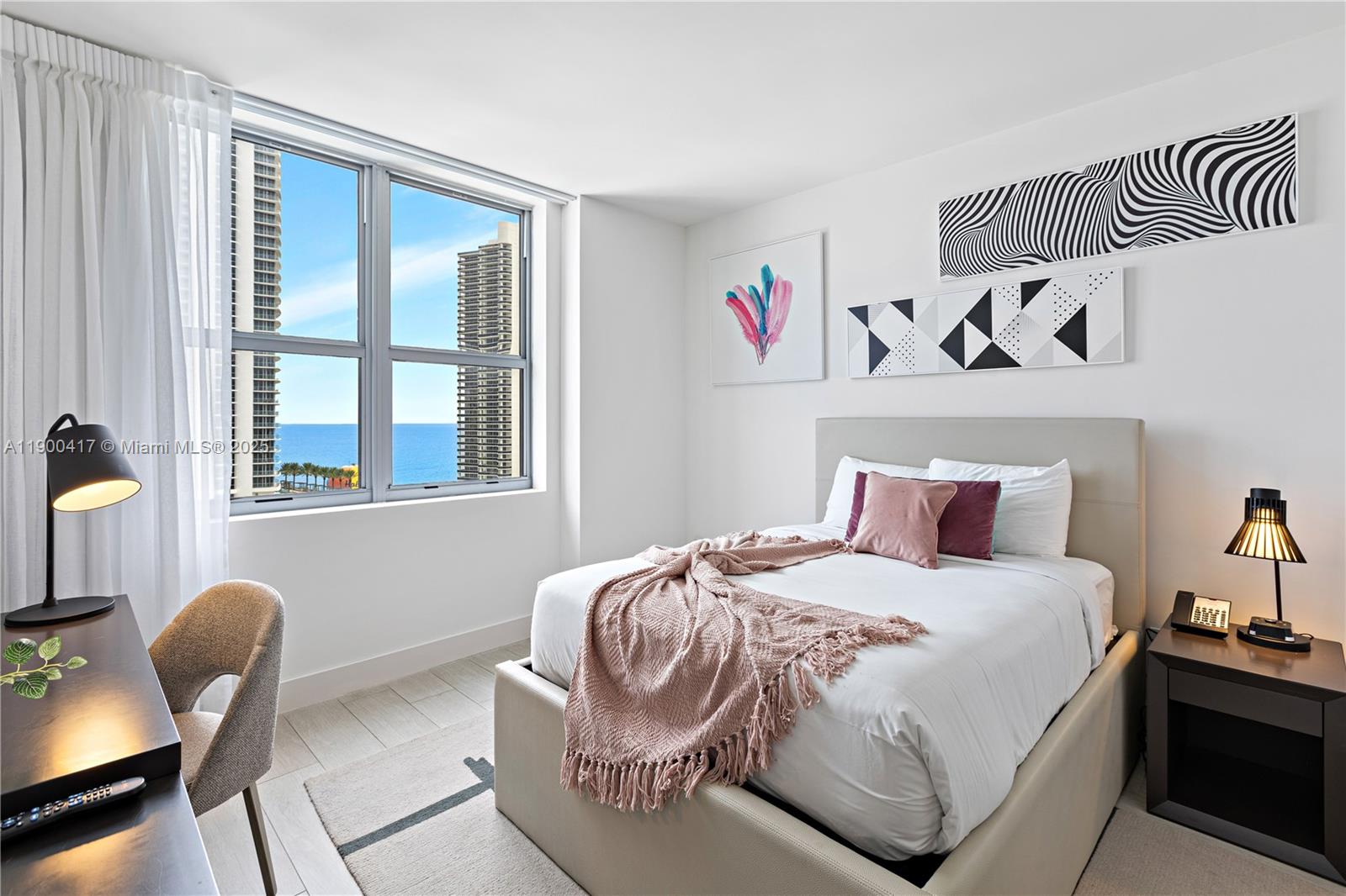 4010 South Ocean Drive, Unit R1701 Hollywood, FL 33019 - Photo 15 of 48 a bedroom with a bed and a window