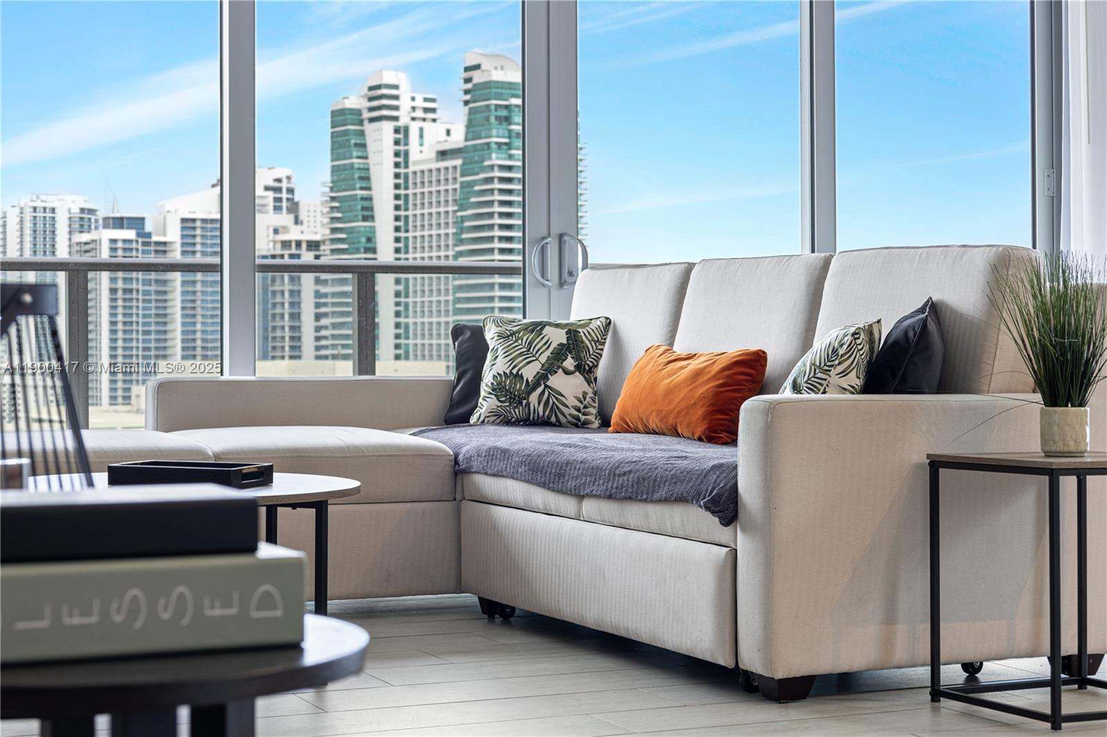 4010 South Ocean Drive, Unit R1701 Hollywood, FL 33019 - Photo 25 of 48 a living room with furniture and a window