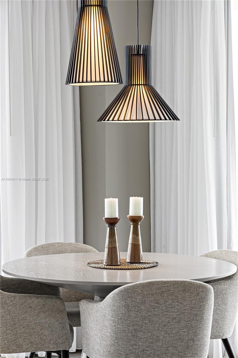 4010 South Ocean Drive, Unit R1701 Hollywood, FL 33019 - Photo 27 of 48 an entryway with a table and a chair