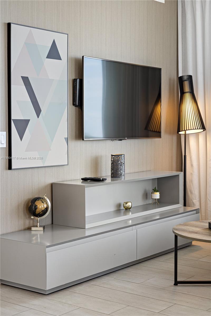 4010 South Ocean Drive, Unit R1701 Hollywood, FL 33019 - Photo 28 of 48 a living room with a couch