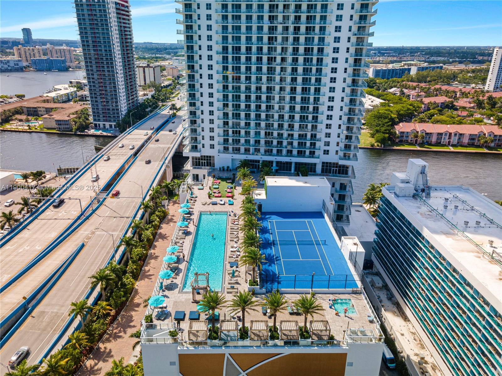 4010 South Ocean Drive, Unit R1701 Hollywood, FL 33019 - Photo 3 of 48 a view of building with yard and sitting area