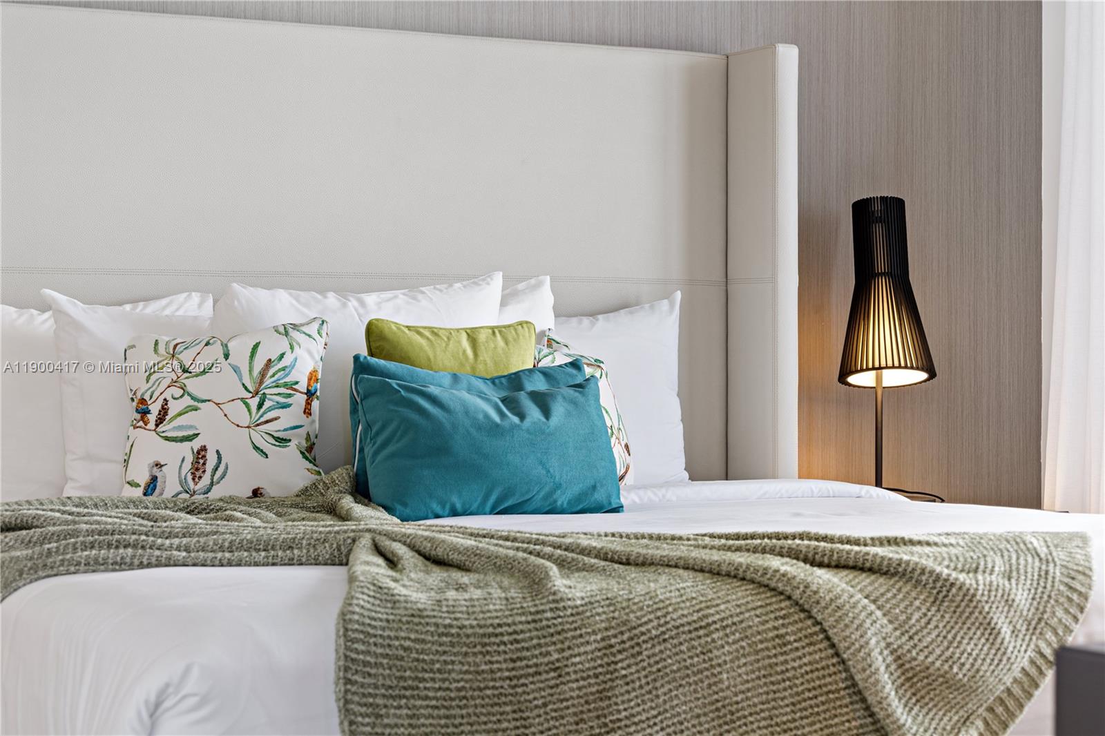 4010 South Ocean Drive, Unit R1701 Hollywood, FL 33019 - Photo 31 of 48 a bedroom with a bed and a dresser