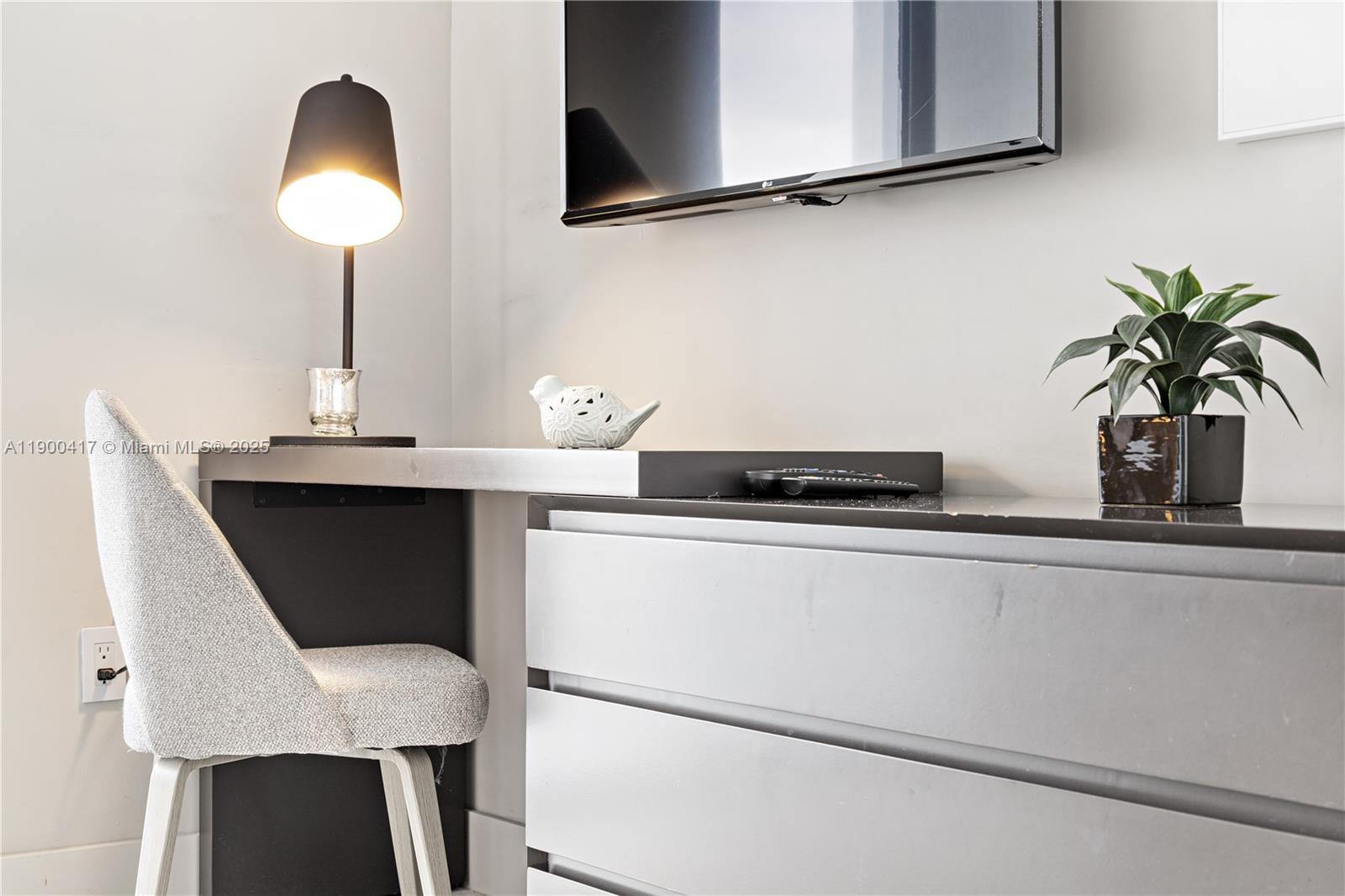 4010 South Ocean Drive, Unit R1701 Hollywood, FL 33019 - Photo 33 of 48 a kitchen with a sink and a potted plant on it