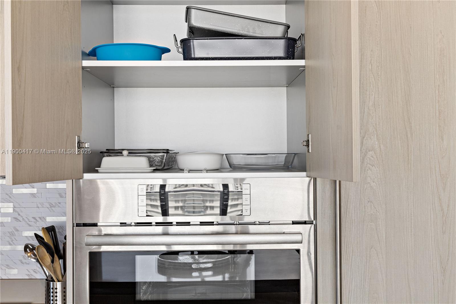4010 South Ocean Drive, Unit R1701 Hollywood, FL 33019 - Photo 42 of 48 a stove top oven sitting inside of a kitchen