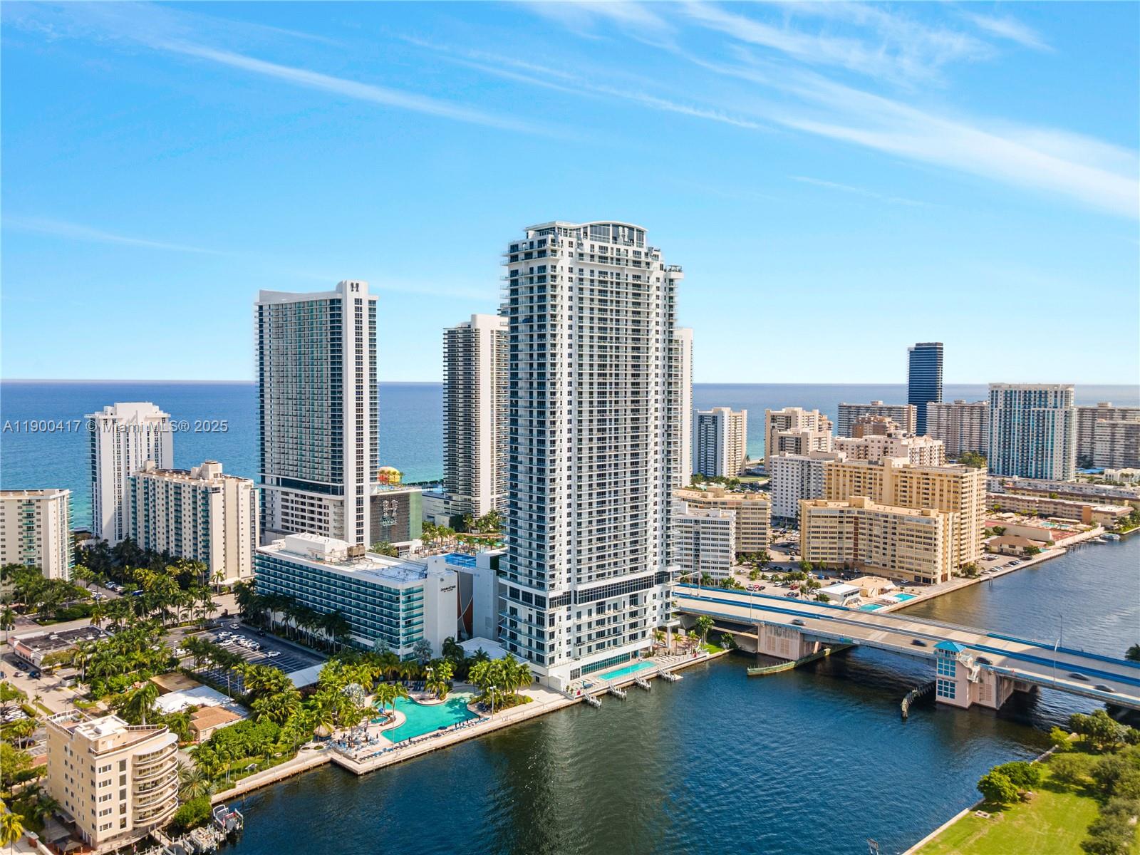 4010 South Ocean Drive, Unit R1701 Hollywood, FL 33019 - Photo 43 of 48 a living room with furniture and a floor to ceiling window