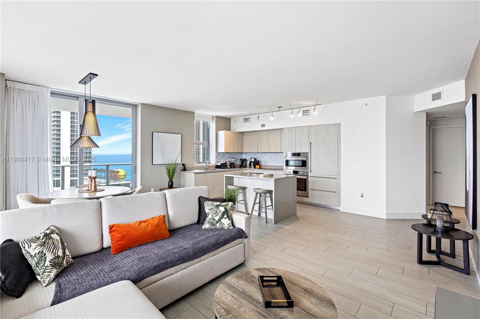 4010 South Ocean Drive, Unit R1701 Hollywood, FL 33019 - Photo 5 of 48 a living room with furniture and a large window