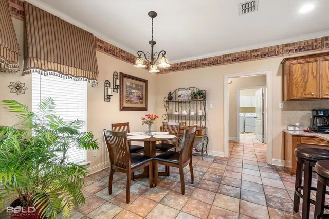 a dining room with furniture and window