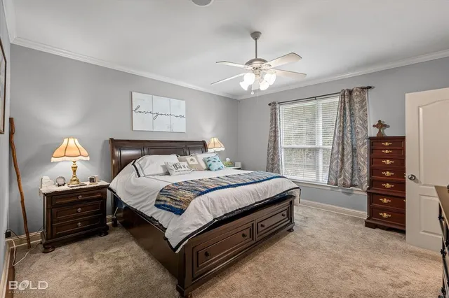 a spacious bedroom with a bed and a desk