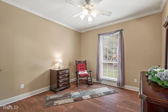 a living room with furniture and flowers