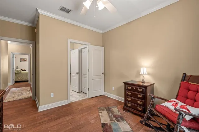 a view of room with furniture and wooden floor