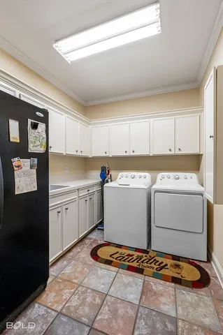a kitchen with a refrigerator and cabinets