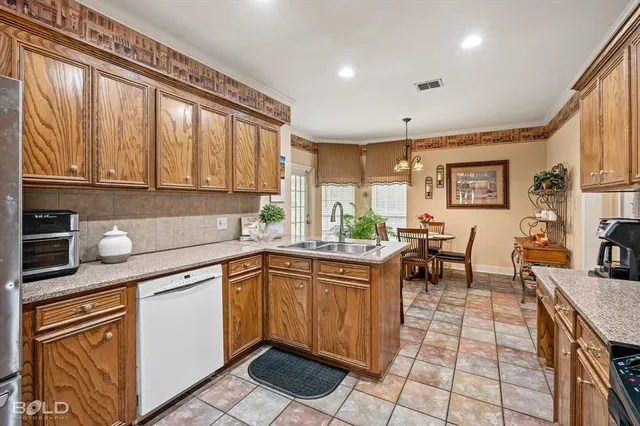 a kitchen with stainless steel appliances granite countertop sink microwave and cabinets