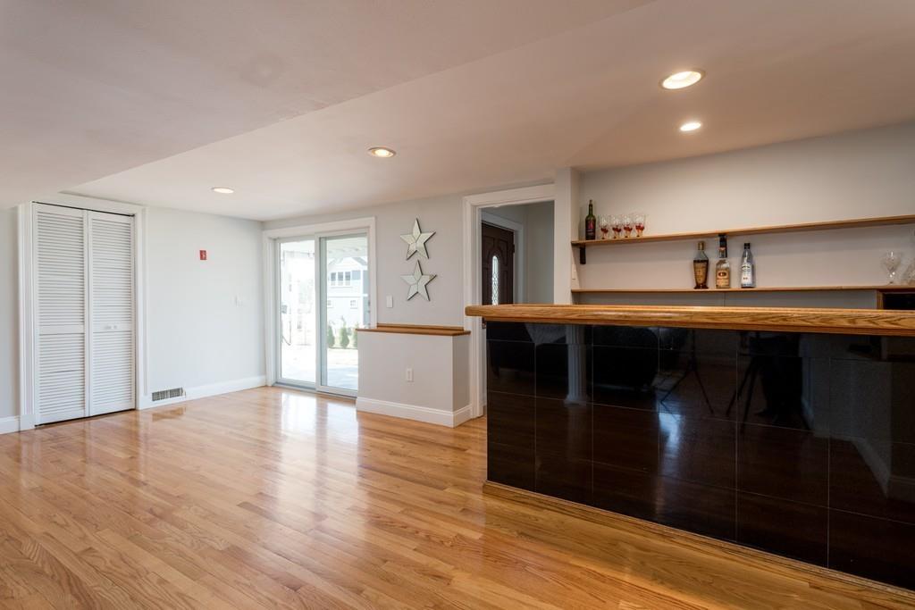 60 Arlo Road Newton, MA 02464 - Photo 11 of 28 a kitchen with stainless steel appliances granite countertop a sink and cabinets