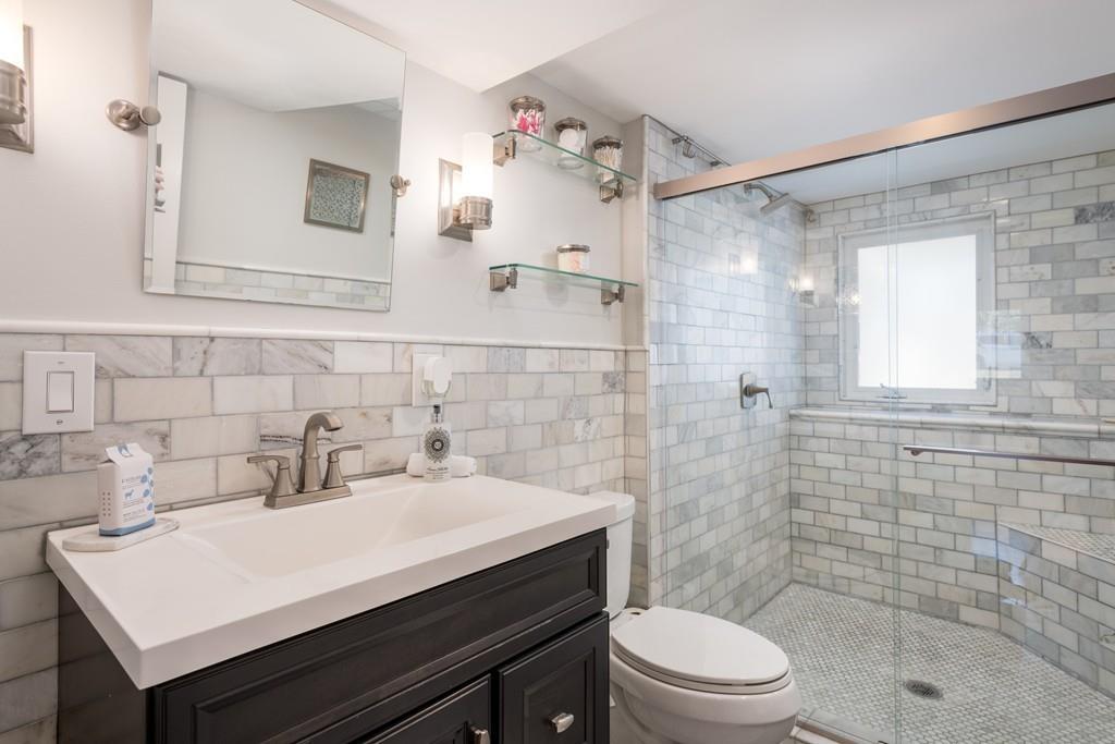 60 Arlo Road Newton, MA 02464 - Photo 13 of 28 a bathroom with a sink a toilet and shower