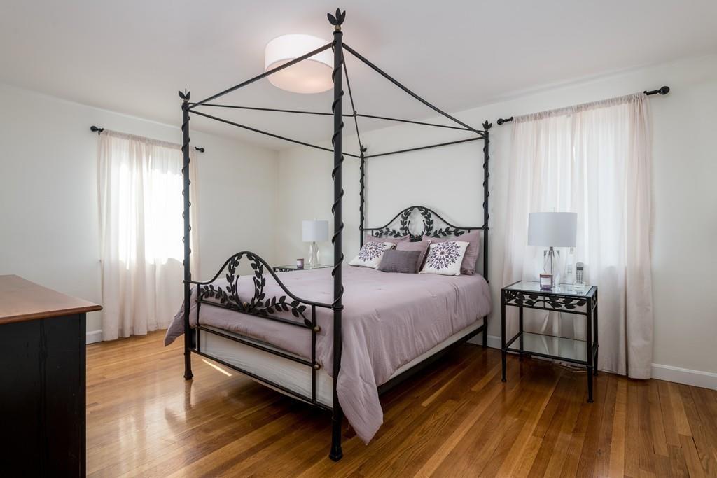 60 Arlo Road Newton, MA 02464 - Photo 16 of 28 a bedroom with a bed and wooden floor