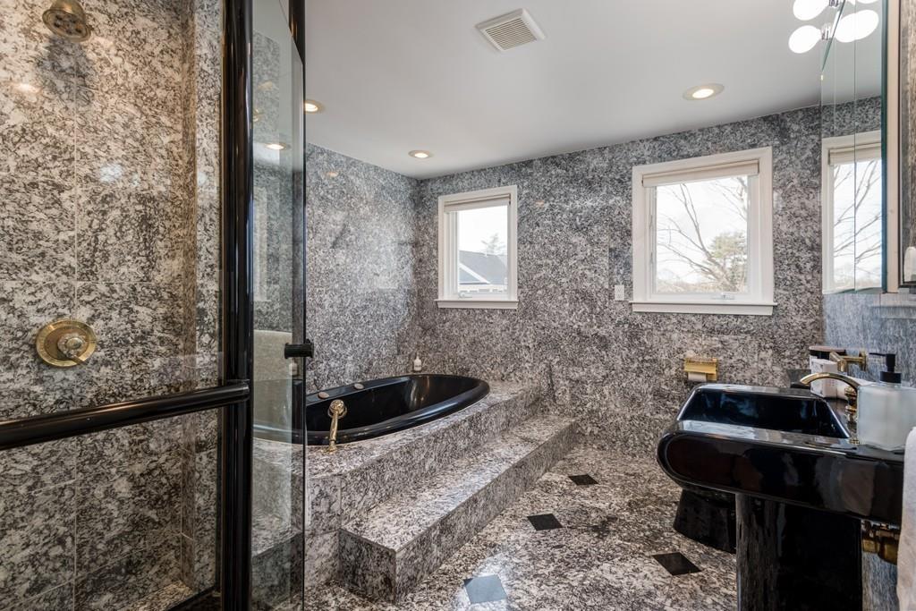 60 Arlo Road Newton, MA 02464 - Photo 17 of 28 a bathroom with a sink and a mirror