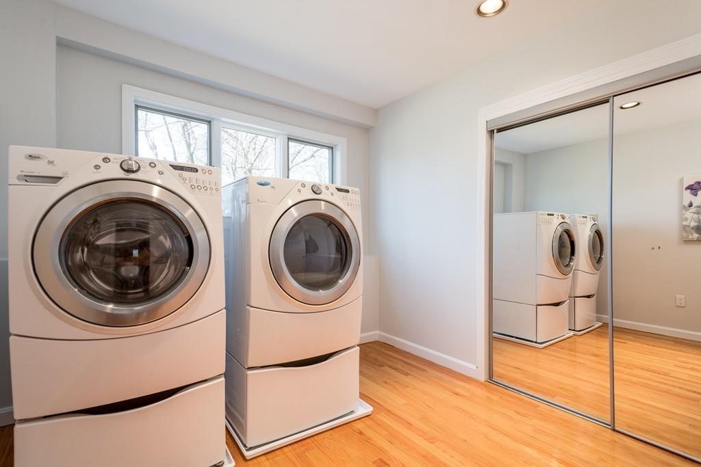 60 Arlo Road Newton, MA 02464 - Photo 23 of 28 a view of a storage & utility room with washer and dryer