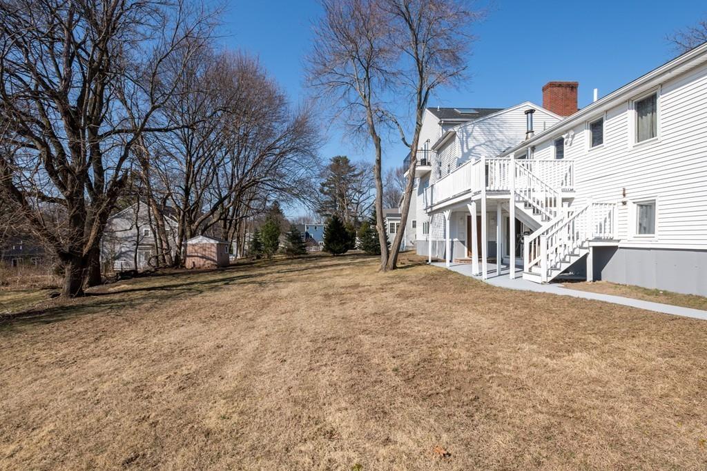 60 Arlo Road Newton, MA 02464 - Photo 25 of 28 a view of large trees with a house