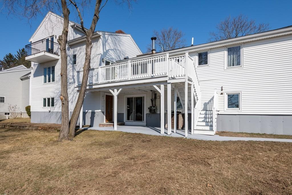 60 Arlo Road Newton, MA 02464 - Photo 26 of 28 a view of a white house with large windows