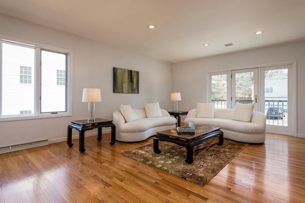 60 Arlo Road Newton, MA 02464 - Photo 8 of 28 a living room with furniture and a wooden floor