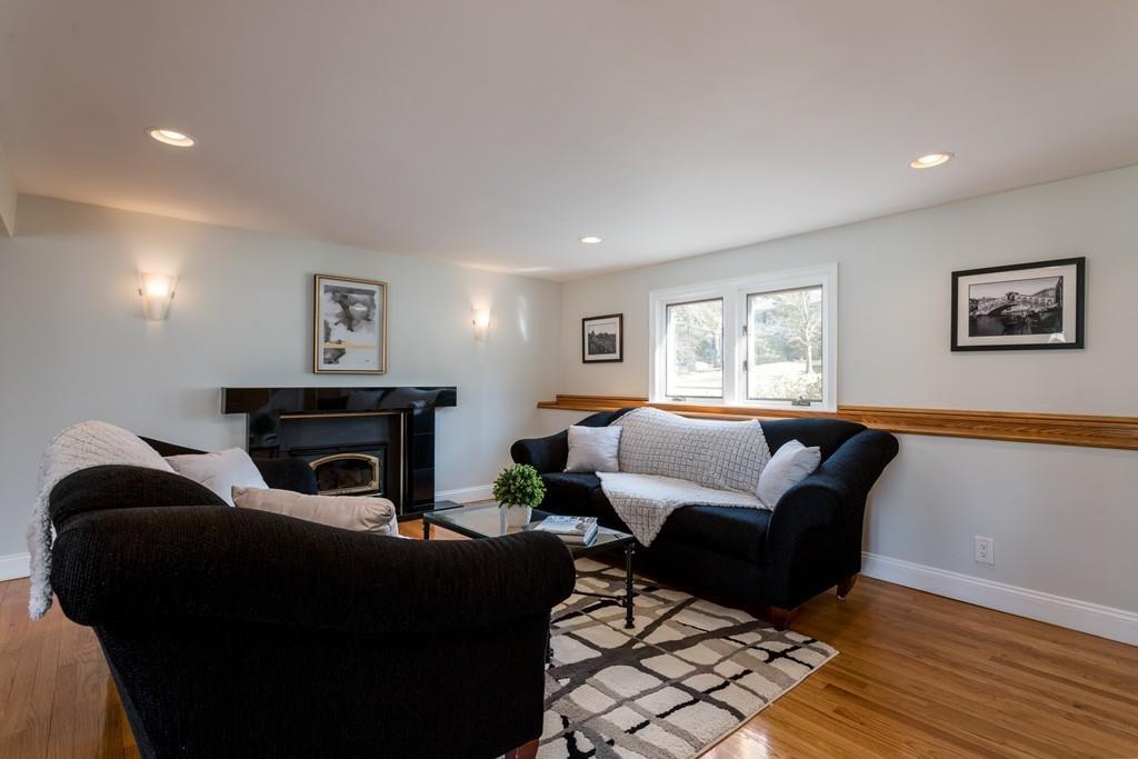 60 Arlo Road Newton, MA 02464 - Photo 9 of 28 a living room with furniture and a fireplace