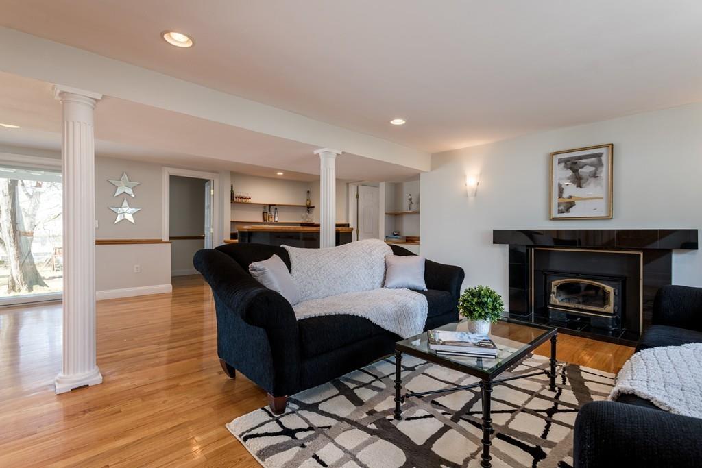 60 Arlo Road Newton, MA 02464 - Photo 10 of 28 a living room with furniture and a fireplace