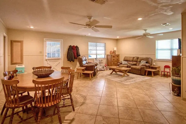 a bed room with furniture and gym equipment