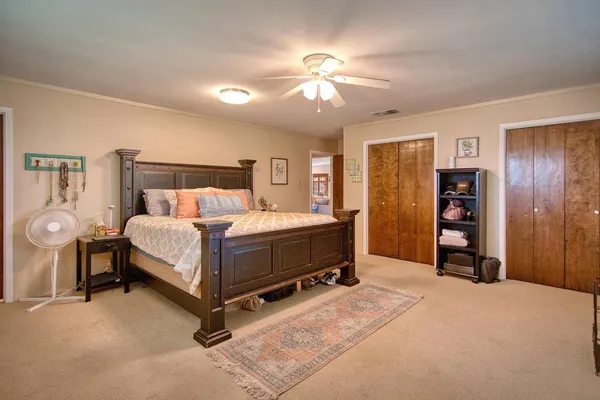 a view of a house with backyard porch and sitting area