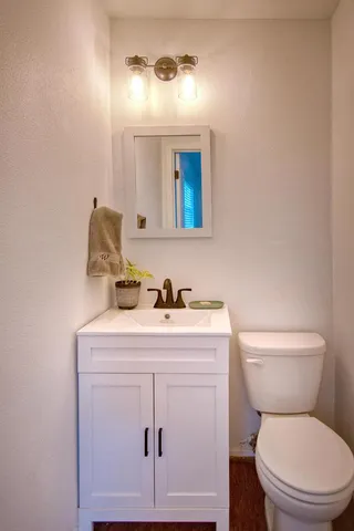 a bathroom with a toilet a sink and a shower
