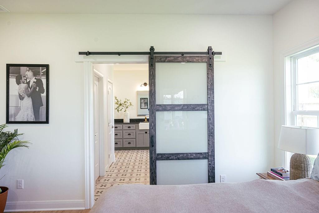 1132 Old Crawford Road Crawford, TX 76638 - Photo 23 of 39 a room with a bed and a mirror