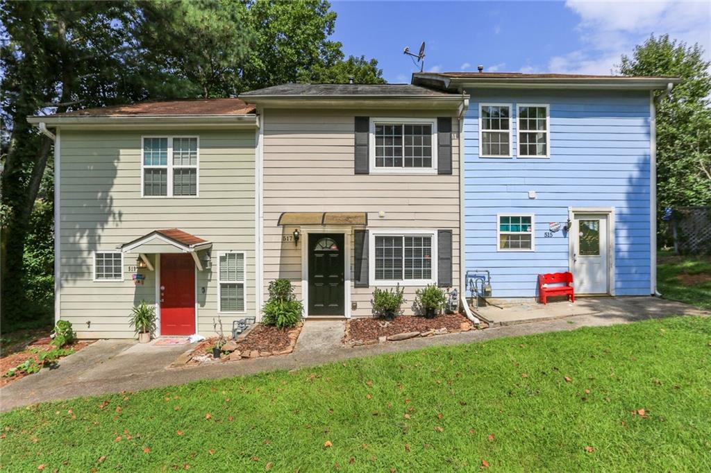517 Granite Ridge Place Sandy Springs, GA 30350 - Photo 1 of 1 a front view of a house with a yard