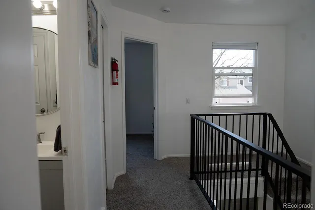 a view of a hallway with windows