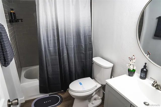 a white toilet sitting next to a bathroom sink