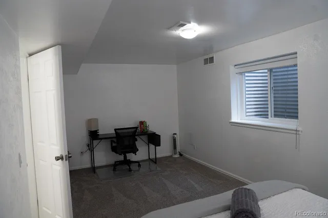 a workspace room with a window