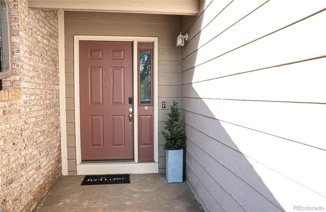 a view of a door and wooden floor