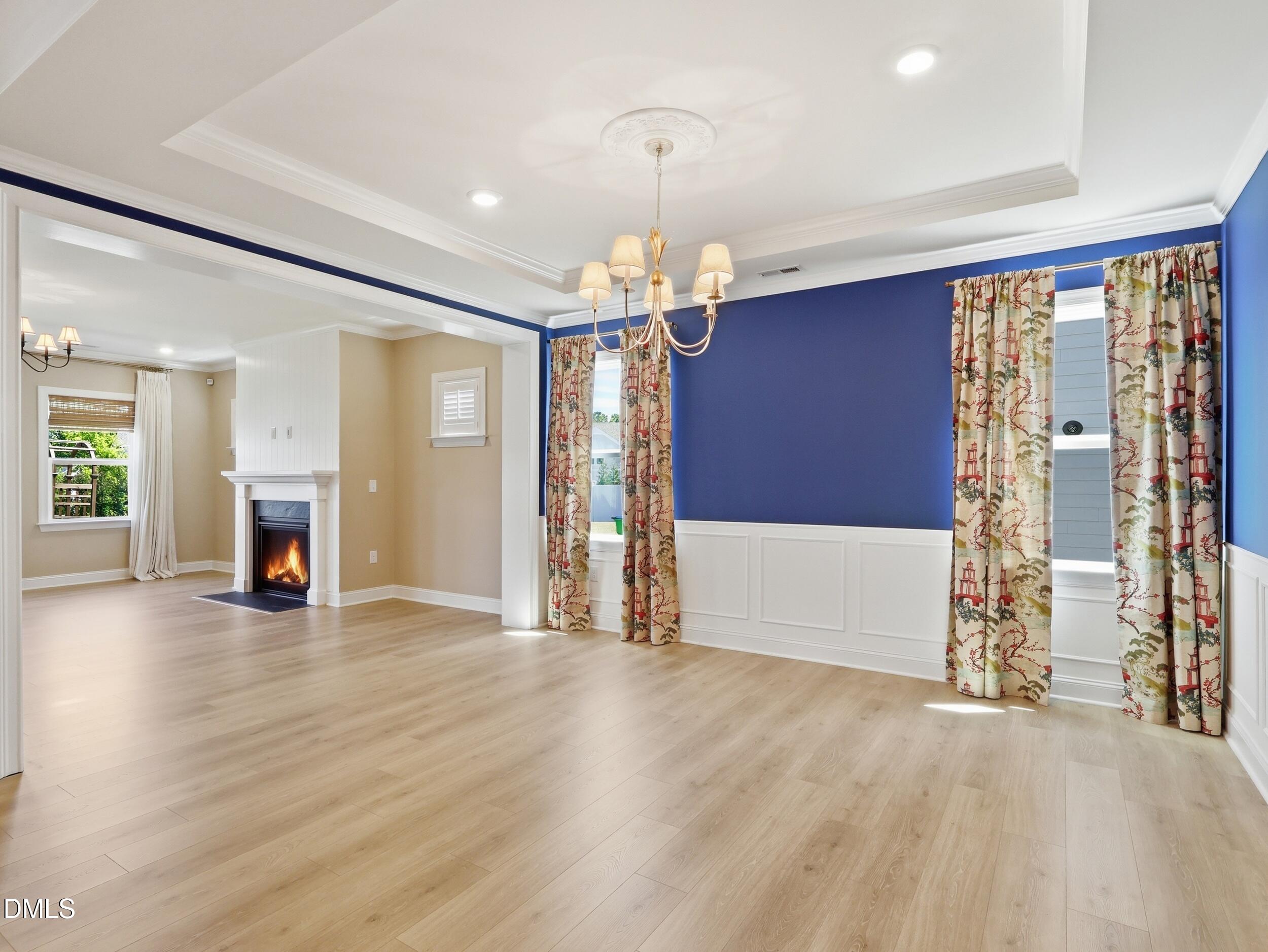 2709 Womble Ridge Drive New Hill, NC 27562 - Photo 13 of 60 a view of a livingroom with a chandelier