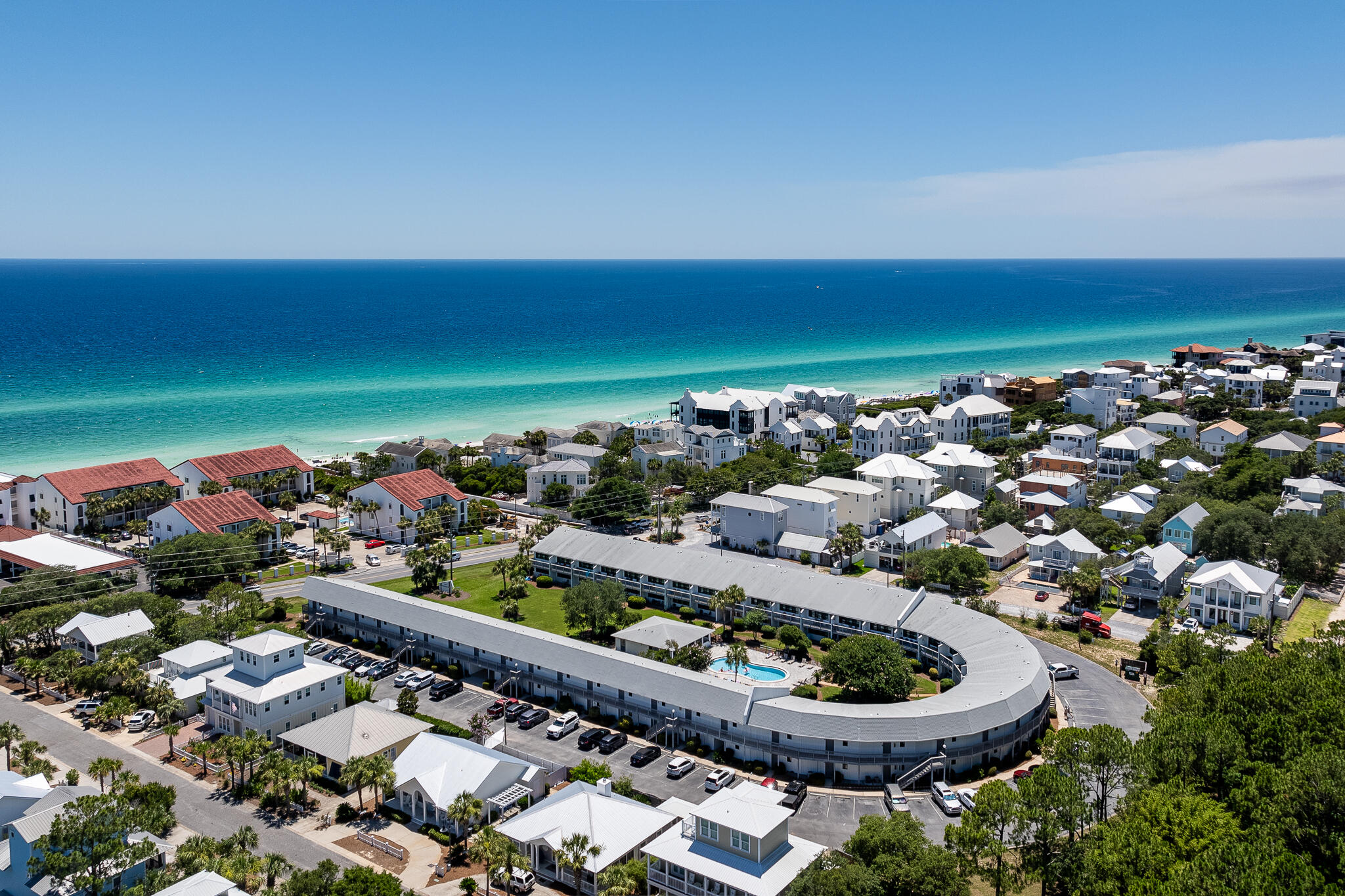 3605 East County Highway 30A, Unit 241 Santa Rosa Beach, FL 32459 - Photo 13 of 23 a view of a backyard with plants and a garden