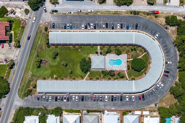 an aerial view of a house with swimming pool