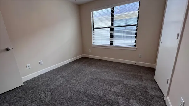 a view of a room that has a window in it