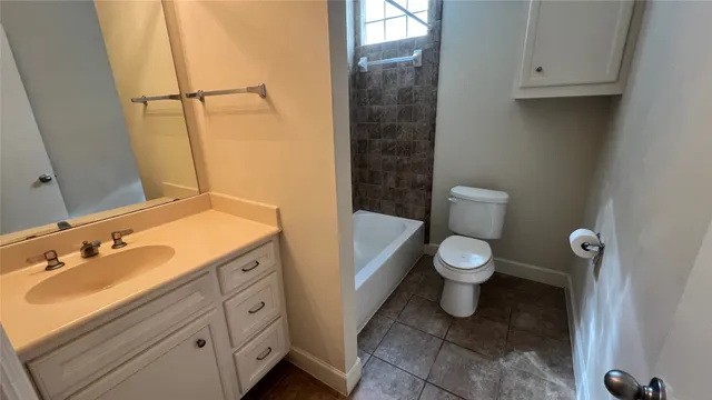 a utility room with wooden floor washer and dryer