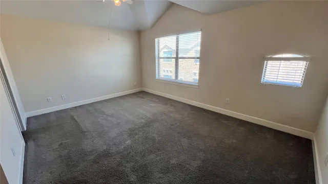 an empty room with a mirror