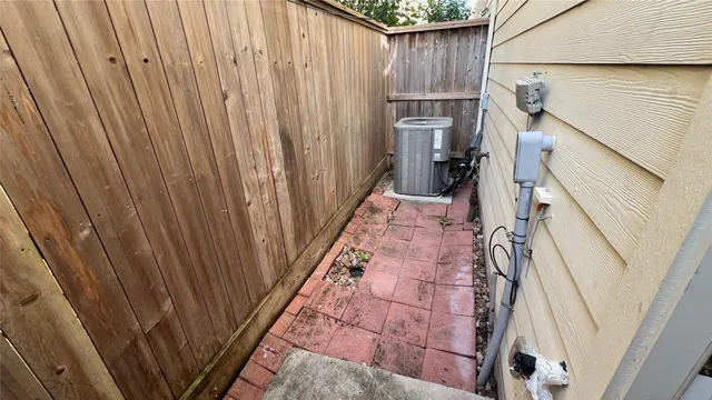 a kitchen with granite countertop white cabinets and appliances