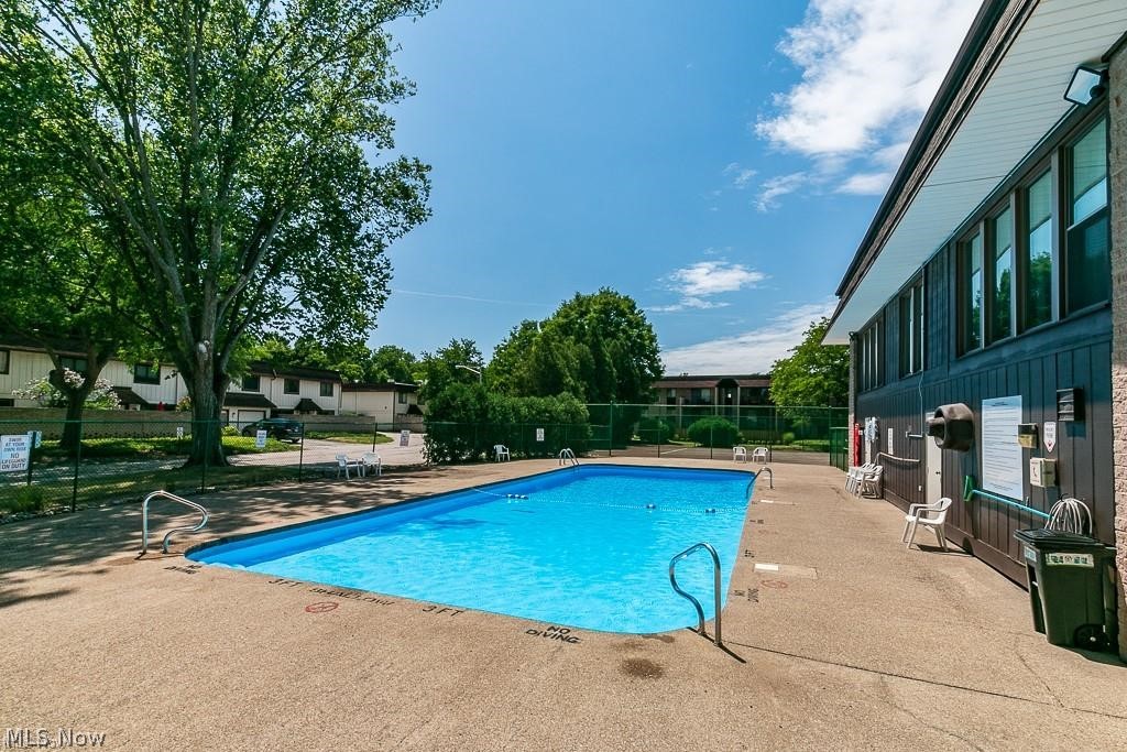 9956 Johnnycake Ridge Road East, Unit A8 Painesville, OH 44077 - Photo 5 of 29 View of swimming pool with a patio area