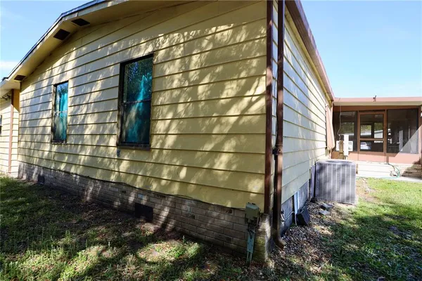 a view of a house with basketball court