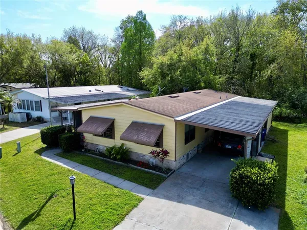 a view of house with outdoor space and porch