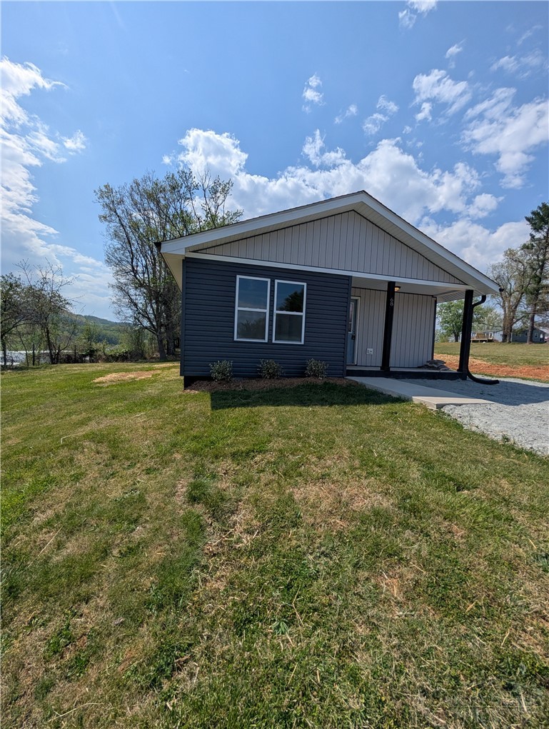 68 Estep Street Sparta, NC 28675 - Photo 3 of 21 a house view with a garden space