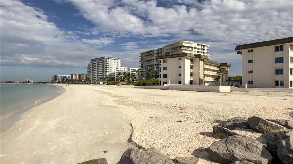 1900 Benjamin Franklin Drive, Unit 201BER Sarasota, FL 34236 - Photo 1 of 21 a view of a terrace with a bench
