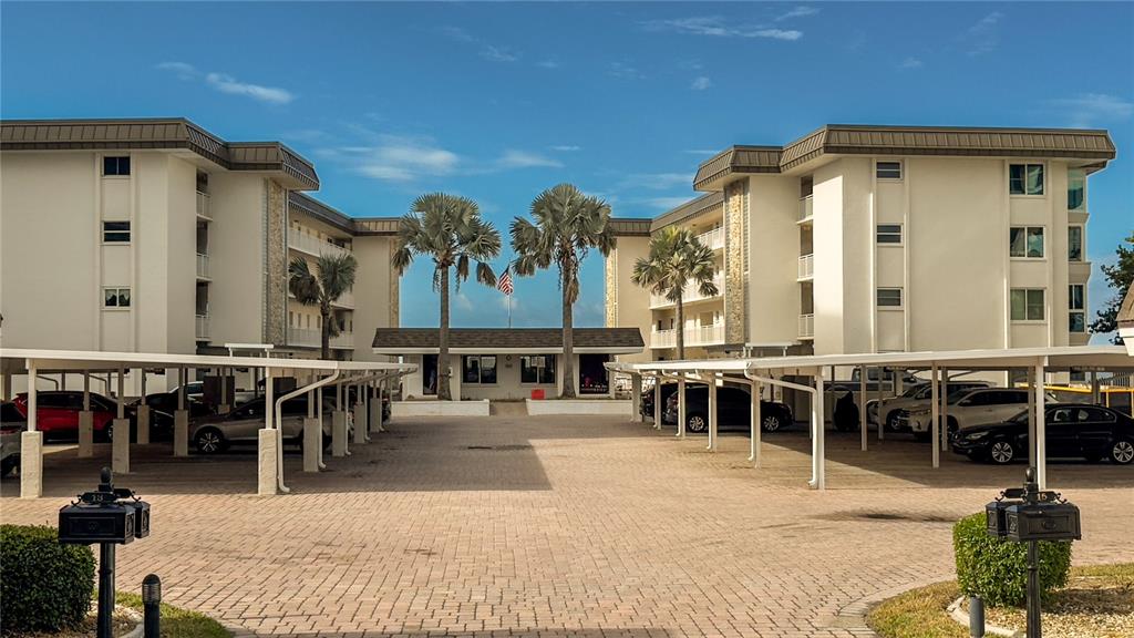 1900 Benjamin Franklin Drive, Unit 201BER Sarasota, FL 34236 - Photo 17 of 21 a view of a swimming pool with outdoor seating