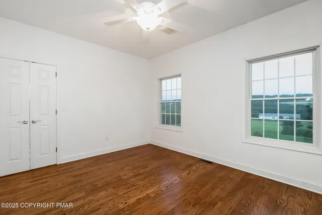 a bathroom with a sink toilet and a mirror